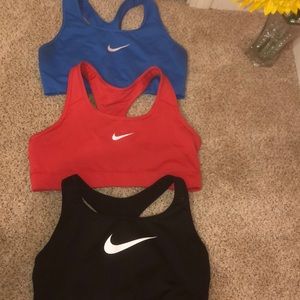 SET OF 3!!!    Women’s Nike dri fit sports bras.